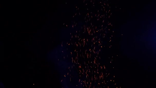 Sparks from fire fly up at night in the moonlight 100 FPS Slow Motion — ストック動画