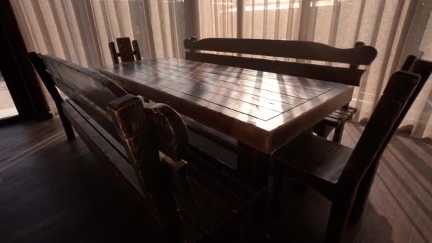 Amazing set up of table and benches in comfort room with natural light. Camera is moving in motion control in 4K — Stock Video