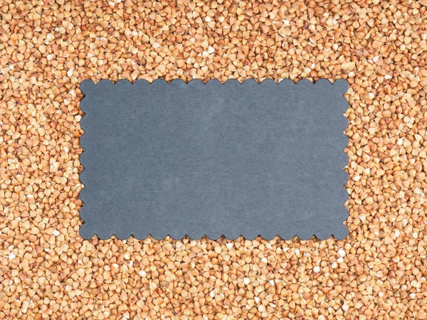 Buckwheat groats background with black copy space. Healthy eatin — Stock Photo, Image