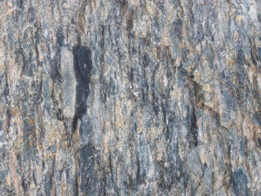 Siyah, gri, sarı gri taşın arka planı. Kafkaslar