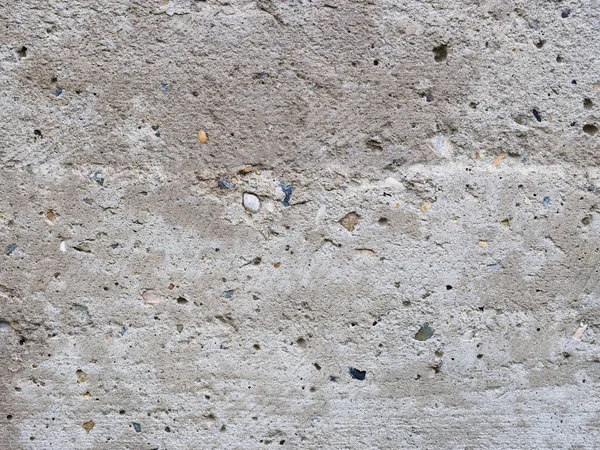 Küçük taşlı eski betondan bir arka plan. Tuapse, Karadeniz — Stok fotoğraf