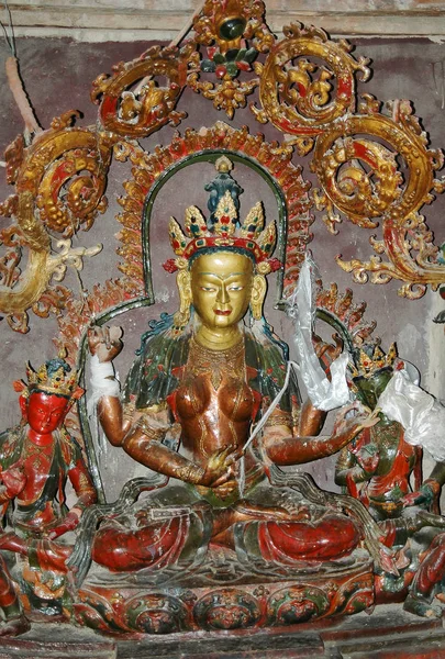 An ancient statue of a female Tibetan deity with a bronze-colore — 스톡 사진