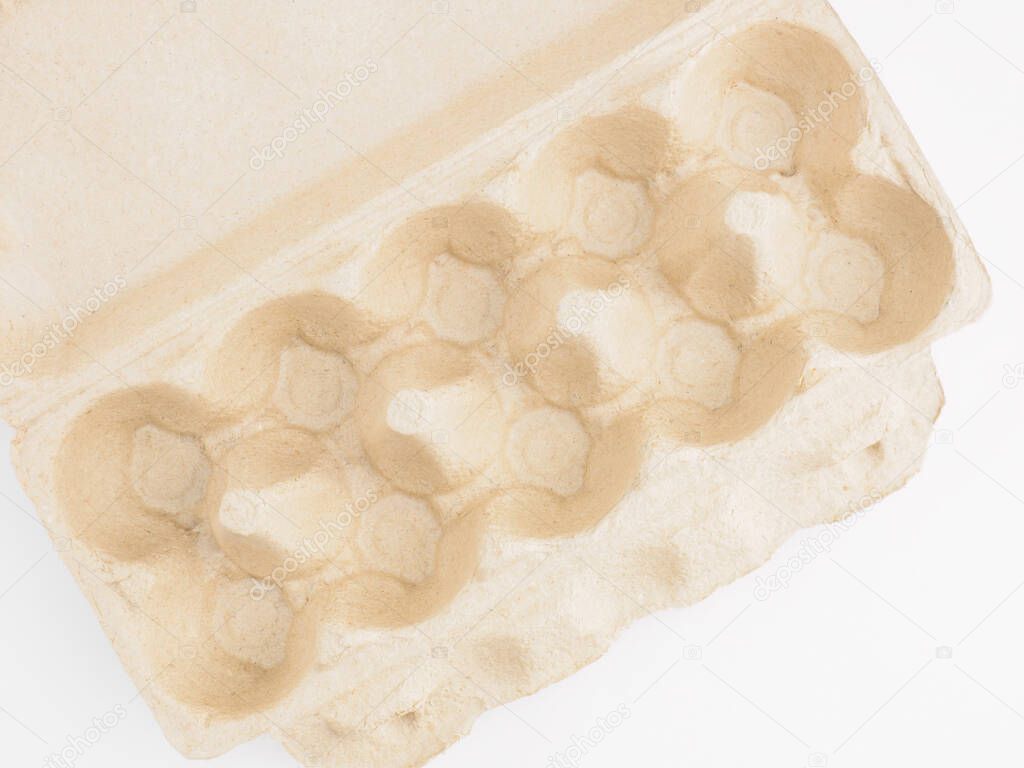 Empty pack from chicken eggs on white background. Healthy eating and organic food concept