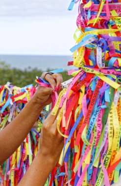 Tourist stripes in City of Porto Seguro in the State of Bahia, Brazil on September 25, 2019 - Our Lord of Bonfim ribbons in Arraial d'Ajuda. clipart