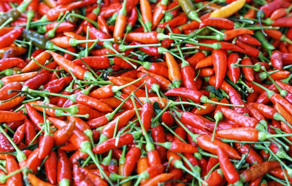 red spicy peppers on the table on farmers market