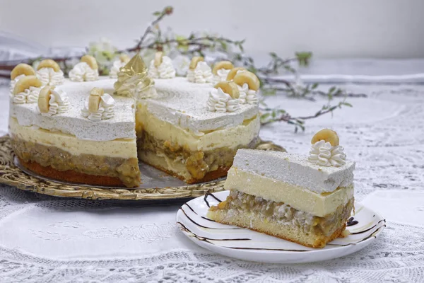 white layer buttercream cake slice on kitchen table