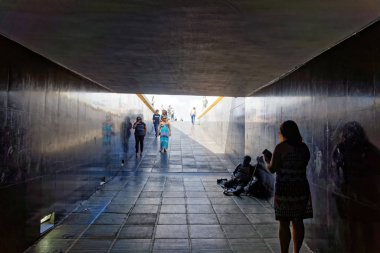 people going through the tunnel to Metropolitan Cathedral of Nossa Senhora Aparecida in Brasilia, Brazil