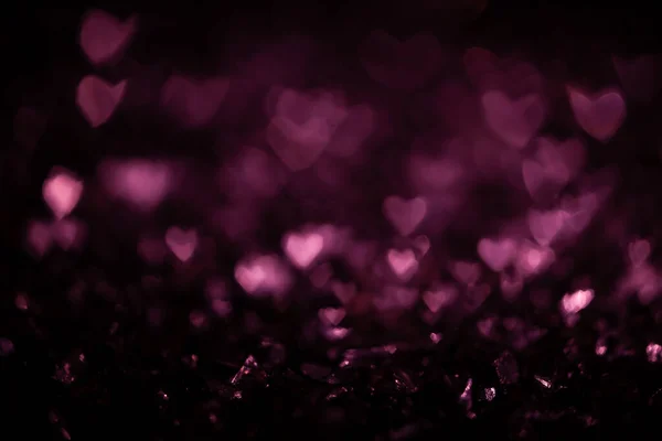 Ciemne abstrakcyjne tło z różowym bokeh rozproszone światła — Zdjęcie stockowe