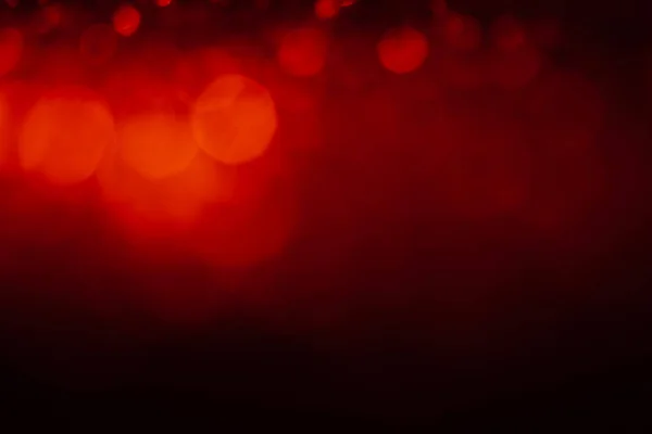 Fondo abstracto rojo con luces desenfocadas bokeh — Foto de Stock