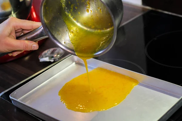Pouring down orange sause — Stock Photo, Image