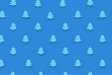 Mavi arka planda mavi Noel ağacı deseni.