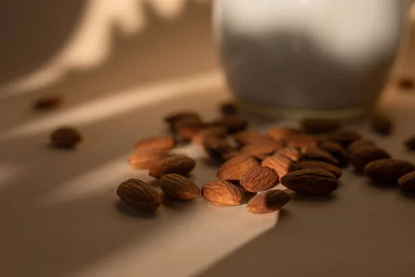 Almond milk in glass with almonds — Stock Photo, Image