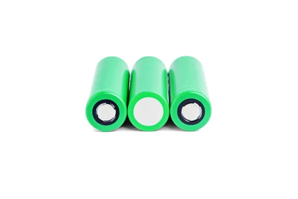 Three rechargeable batteries on a white background isolated. 18650 green batteries. device energy concept — 스톡 사진