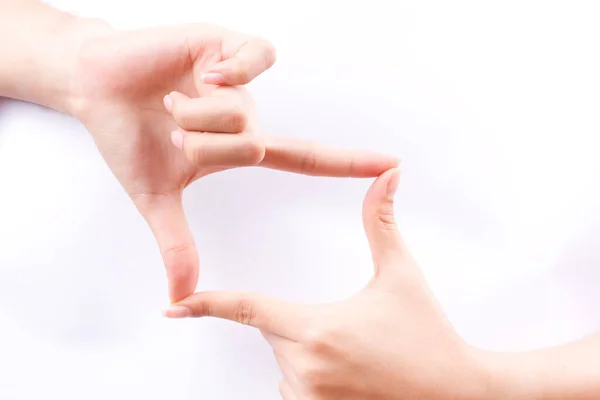 指の手のシンボル写真を撮るためのフレーム構成白い背景に隔離されたファインダー — ストック写真