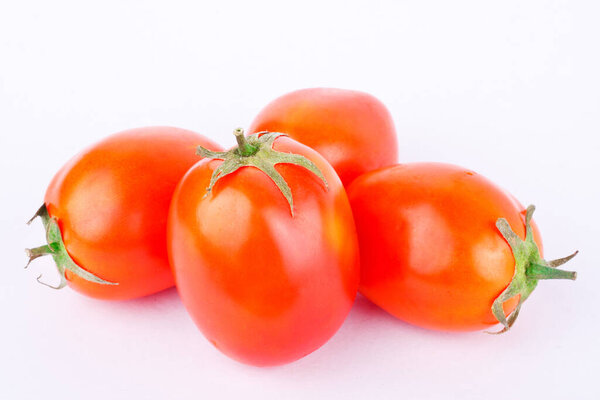 Red tomato is a vegetable, that is healthy on the white background isolated