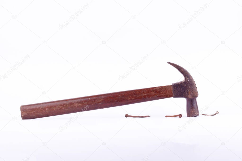  old rust Traditional curved claw hammer and nail tack used on white background tool isolated