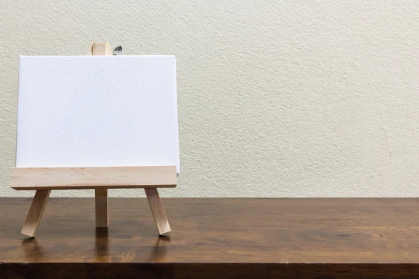 Empty blank whiteboard on the wooden table