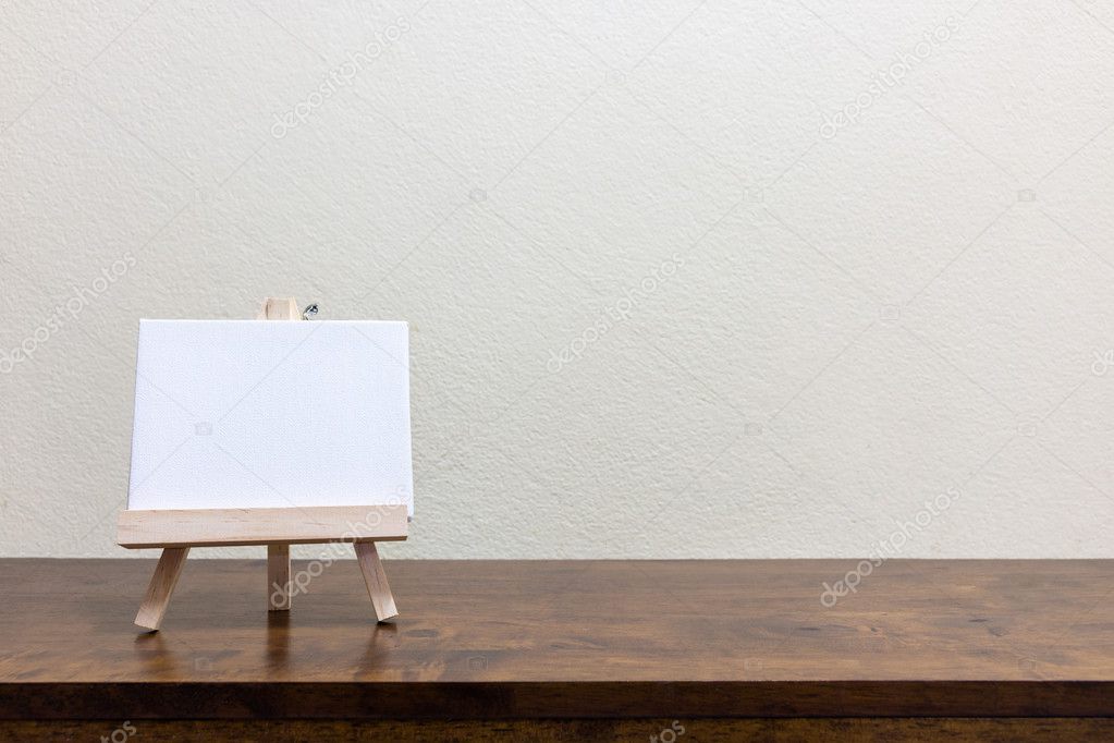 Empty blank whiteboard on the wooden table 