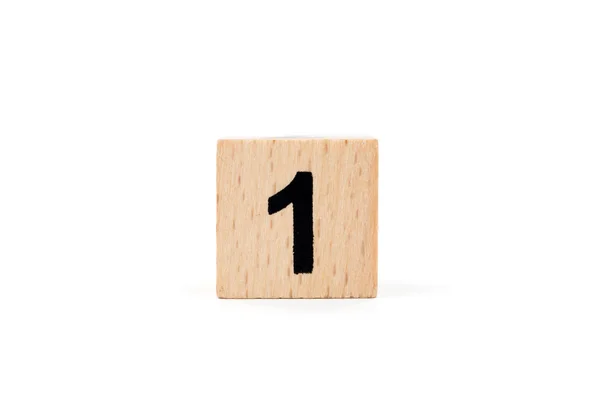 Holzblock Nummer eins auf weißem Hintergrund — Stockfoto