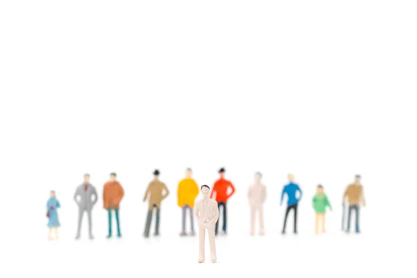 Skupina miniaturních lidí stojící na bílém pozadí — Stock fotografie