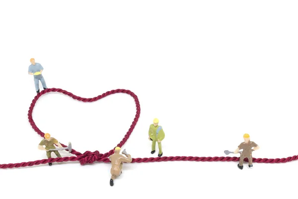 Miniature worker team building Heart Shaped with rope