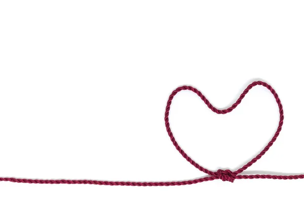Heart Shaped Knot on a rope on white background — Stock Photo, Image
