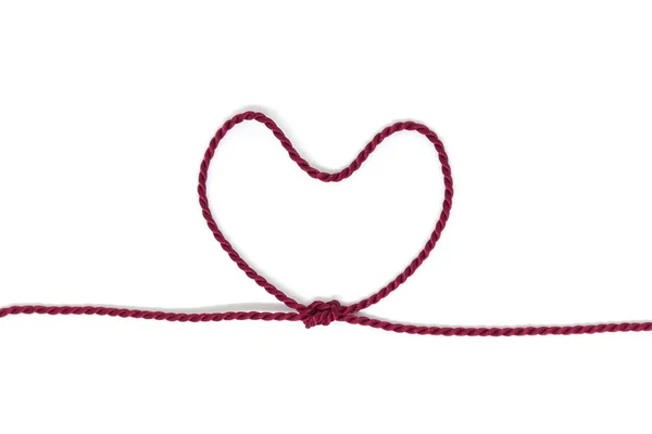 Heart Shaped Knot on a rope on white background — Stock Photo, Image