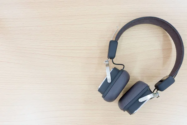 Bluetooth headset on wooden backgroun — Stock Photo, Image
