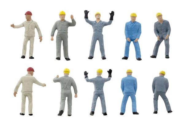 Концепция строительства миниатюрных рабочих на белом фоне — стоковое фото