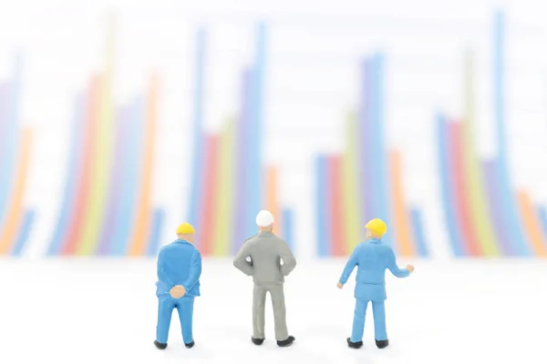 Businessman standing on a graph chart — Stock Photo, Image