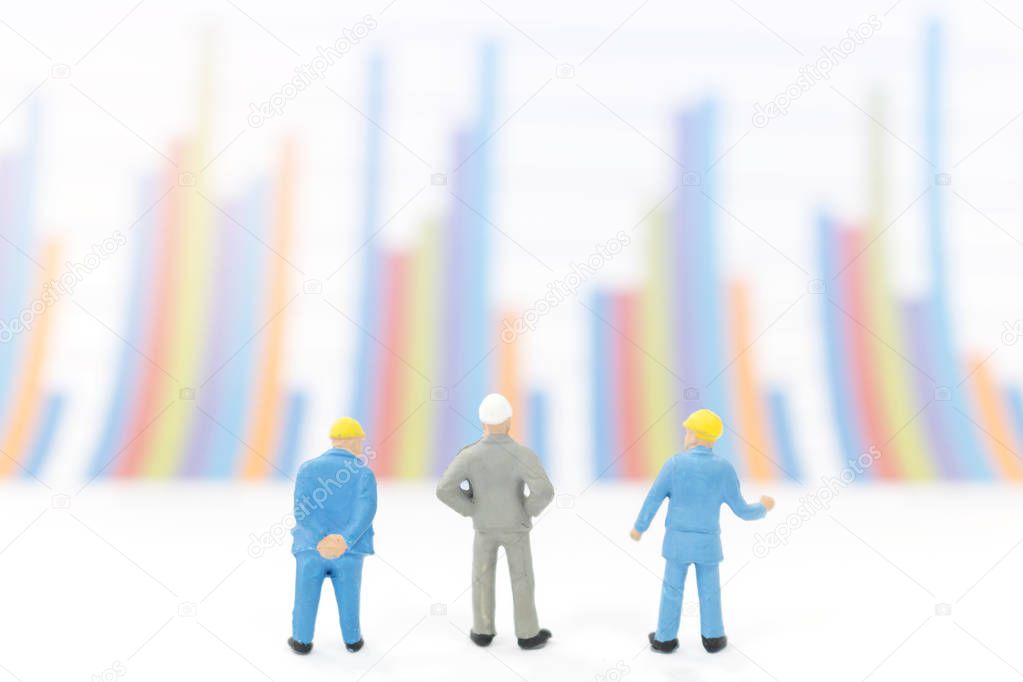Businessman standing on a graph chart  