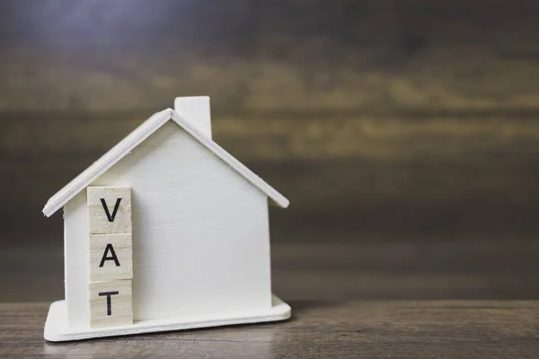 House model with vat word on wooden blocks. — Stock Photo, Image