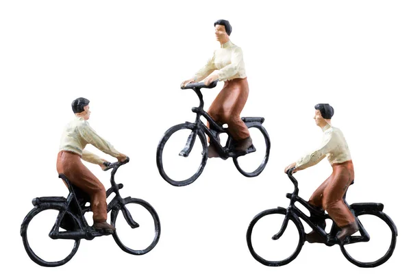 Miniatyr figur rida cykel isolerad på vit bakgrund — Stockfoto