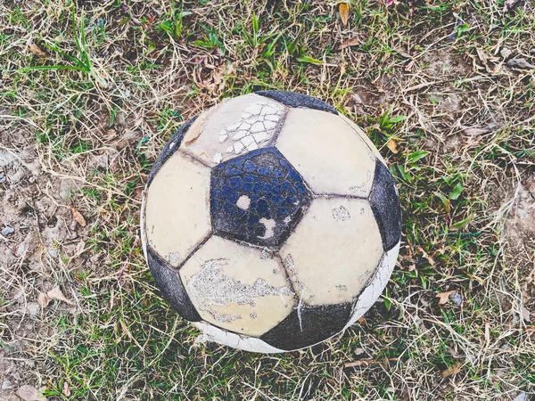 Old soccer ball on the ground (Taken with Smartphone)