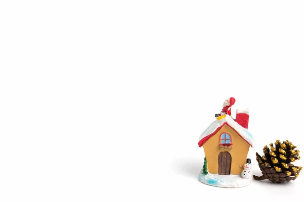 Santa claus sitting on a roof on white background — Stock Photo, Image