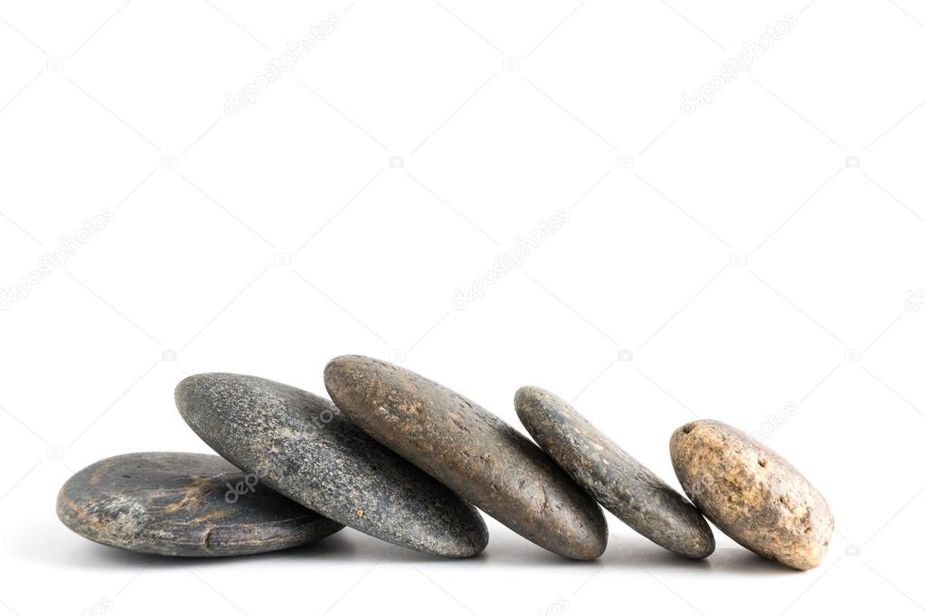 Stack of stones balancing isolated on white background