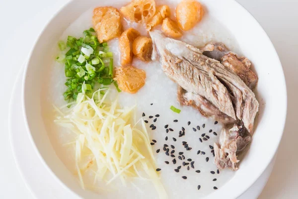 Pork porridge with ginger and coriander in bowl. — Stock Photo, Image