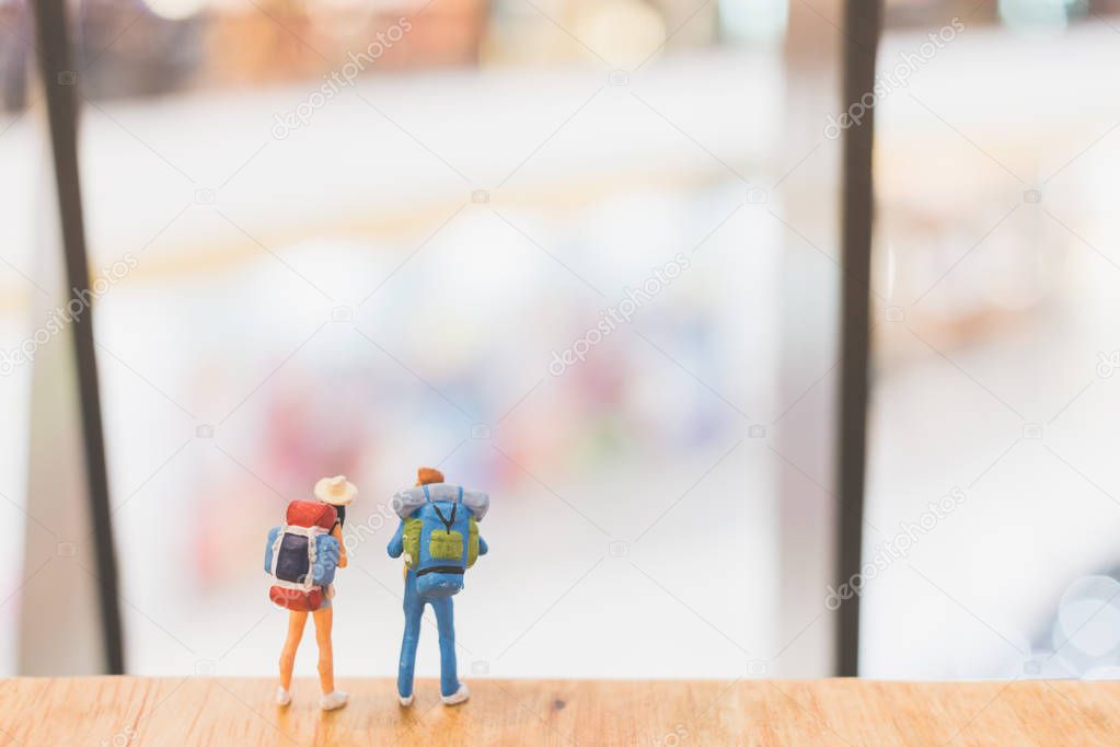 Miniature people : Travellers walking on The bridge 