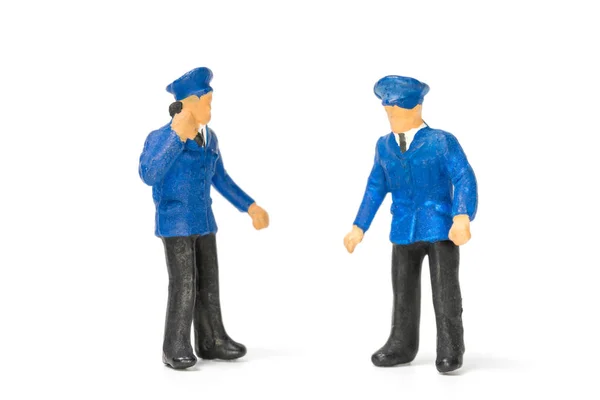 Miniatűr emberek: rendőr, fehér háttér — Stock Fotó
