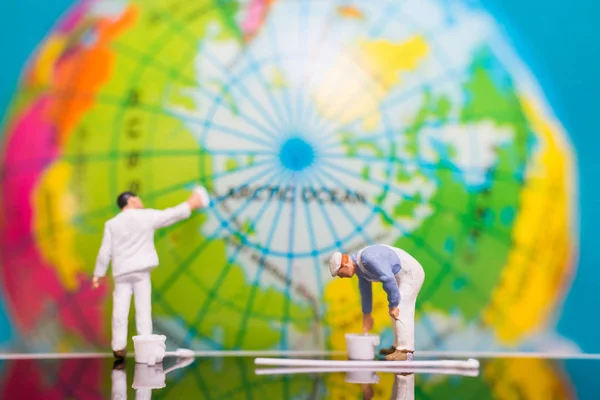Miniature people : Painters painting on The globe  background