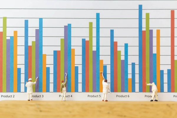 Miniature people : Worker painting business graph