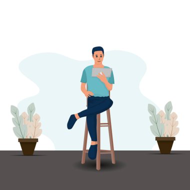 Tabletli adam sandalyede oturuyor. Ev kavramından çalış