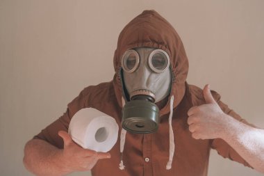 Man in a gas mask and toilet paper. clipart