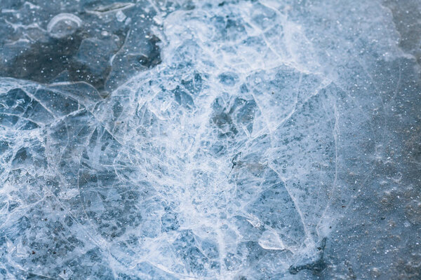 Blue ice. Dark ice with a crack. Broken ice texture