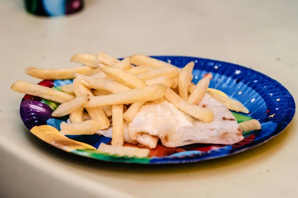 French fries on a colored plate — Stock Photo, Image