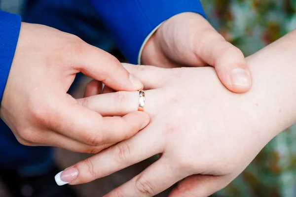 Newlyweds wear each other\'s rings