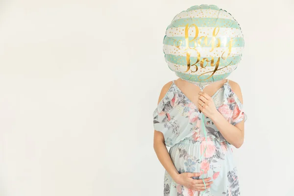 Young pregnant woman is holding blue balloons - Gender Reveal - — 스톡 사진