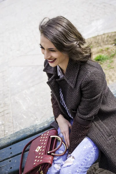 Young brunette lady posing on the streets — Stock Photo, Image