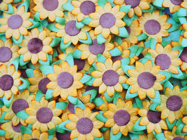 Umělá slunečnice s zelený list, květinové pozadí — Stock fotografie