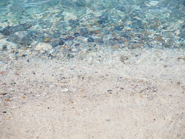 Padrão de onda do mar na praia de seixos — Fotografia de Stock